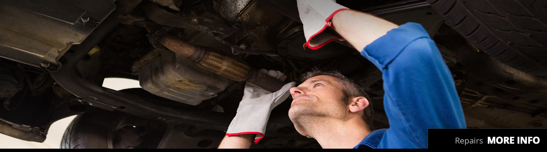 Machanic holding exhaust to repair vehicle